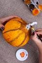 Home autumn crafts from papier mache, pumpkin for Halloween, making process Royalty Free Stock Photo