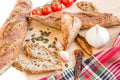 Home baked baguettes, fresh and dry tomatoes, garlic, pumpkin se