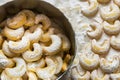 Home baked German Austrian traditional Christmas cookies vanilla crescents in tin box and on tray powdered with castor sugar Royalty Free Stock Photo