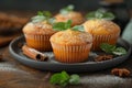 Home-baked muffins with cinnamon and mint on plat