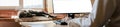 Home base office with IT equipment and online communications. Remote working and flexible hours concept. Panorama Royalty Free Stock Photo