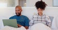 Home, bed and black couple with a laptop, technology and smile with love, internet and streaming a movie. Bedroom Royalty Free Stock Photo