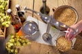 Home Brewing of Beer. Man Weighs Barley. Royalty Free Stock Photo