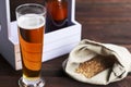 Home brewing concept. Make a lager beer with natural ingredients. Still life with beer and barley on wooden background Royalty Free Stock Photo