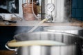 Home Brewing Kit and Pouring Craft Beer Wort into the Boil Kettle. Royalty Free Stock Photo