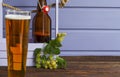 Home brewing. Make a light beer from natural ingredients. Still life with hops and beer on a wooden background. Copy space Royalty Free Stock Photo