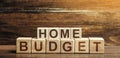 Home budget made of blocks. Planning financial income and expenses, saving and reducing expenses. Self-control, monitoring.