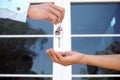 Home buyers are taking home keys from sellers. Sell your house, rent house and buy ideas Royalty Free Stock Photo