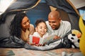 Home, camping and child reading story book, cartoon comic books and bonding with mother, father or happy family parents Royalty Free Stock Photo