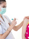 Home care doctor service virus corona covid 19 vaccination little girl receiving injection in doctor office Royalty Free Stock Photo