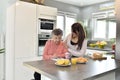 Home carer assisting an elderly woman