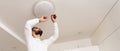 Home Ceiling Light Equipment Maintenance. Professional Electrician Worker. Royalty Free Stock Photo