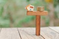 Home and coins balancing on wooden. Property investment and house mortgage financial real estate concept.  Saving money for buy a Royalty Free Stock Photo