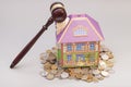 Home, coins and gavel.Real estate concept