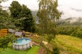 Home collapsible pool. A small rubber swimming pool within the country villa in the mountains