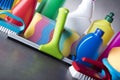 Variety cleaning products on gray background. Royalty Free Stock Photo