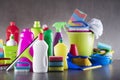 Variety cleaning products on gray background. Royalty Free Stock Photo