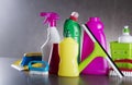 Variety cleaning products on gray background. Royalty Free Stock Photo