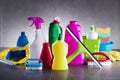 Variety cleaning products on gray background. Royalty Free Stock Photo