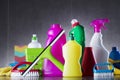 Variety cleaning products on gray background. Royalty Free Stock Photo