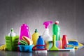 Variety cleaning products on gray background. Royalty Free Stock Photo