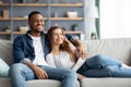 Home Comfort. Loving Young Mulicultural Couple Relaxing On Couch Together Royalty Free Stock Photo