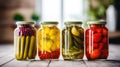 Home conservation for the winter. 4 glass jars with canned vegetables cucumbers, tomatoes, herbs, spices. Healthy food