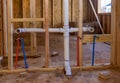 Home construction with hot and cold blue and red pex pipe layout in pipes new bathtub house PVC waste water system Royalty Free Stock Photo
