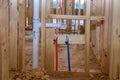 Home construction with hot and cold blue and red pex pipe layout in pipes new bathtub house PVC waste water system Royalty Free Stock Photo