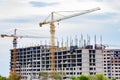 Home construction. How a tower crane builds a house Royalty Free Stock Photo