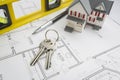 Home, Construction Level, Pencil and Keys Resting on House Plans Royalty Free Stock Photo