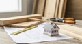 Home construction planning concept with miniature house and tools, ideal for diy renovation projects Royalty Free Stock Photo