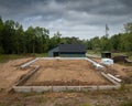 Home construction site with wood forms prepared for concrete cement Royalty Free Stock Photo