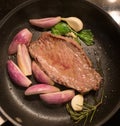 Home Cooking: grilled Steak with onions and herbes Royalty Free Stock Photo