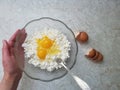 Home cooking  - preparing the cottage cheese and egg mixture for baking Royalty Free Stock Photo