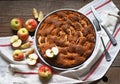 Home cooking.Summer apple pie or biscuit on a white napkin with fresh pears on a wooden rustic table