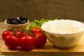 Home cooking summer Greek salad on wooden background