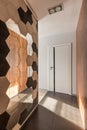 Home corridor with hexagonall mirror