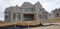 Home in Dark Gray Under Construction in Suburbia Royalty Free Stock Photo