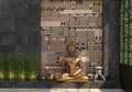 Home decor with a gold statue of Buddha against a black wall with an ethnic pattern of stones. The composition of a set of decorat Royalty Free Stock Photo