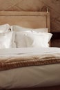 Home decor and interior design, bed with white bedding in luxury bedroom, bed linen laundry service and furniture detail