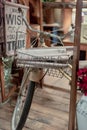 Home decor shop using a vintage bicycle wire basket to display t