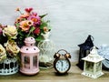 Home decoration with candle lanterns and flowers bouquet Royalty Free Stock Photo
