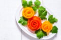 Home decoration for festive dishes - roses from tomatoes