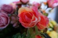 Close up of pink roses fake flowers composition macro, flowers decoration ornamental background, made from fabric and plastic Royalty Free Stock Photo