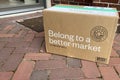 Home-delivered box with healthy and organic products from Thrive Market put on the ground.