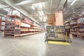 Home Depot staff helping customer cutting wood lumber