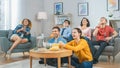 At Home Diverse Group Friends Watching TV Together, Eating Snacks and Drinking Beverage. They Prob Royalty Free Stock Photo