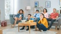 At Home Diverse Group Friends Watching TV Together, Getting Emotionally Terrified and Horrified by Royalty Free Stock Photo