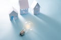 Home Energy with light bulb on the blue background Royalty Free Stock Photo